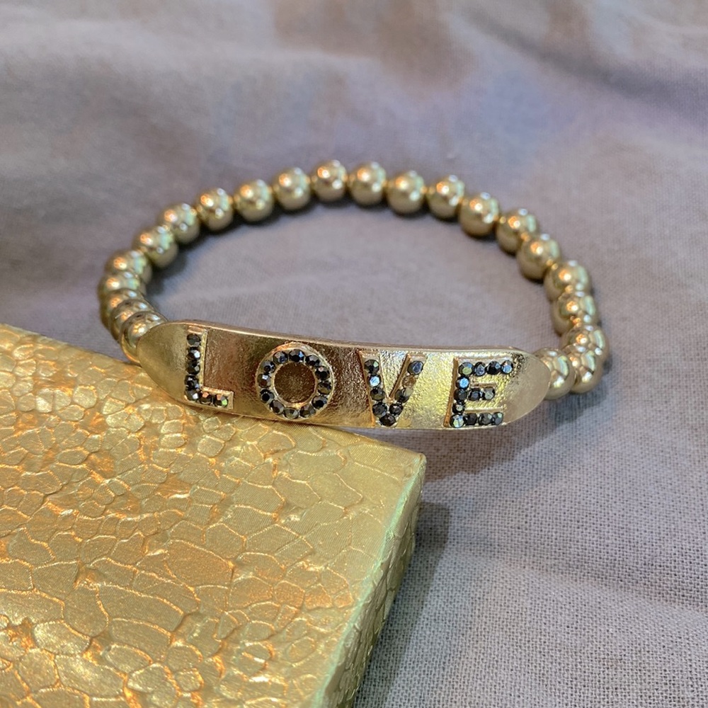 Merlyn Schiff gold-tone “LOVE” bracelet